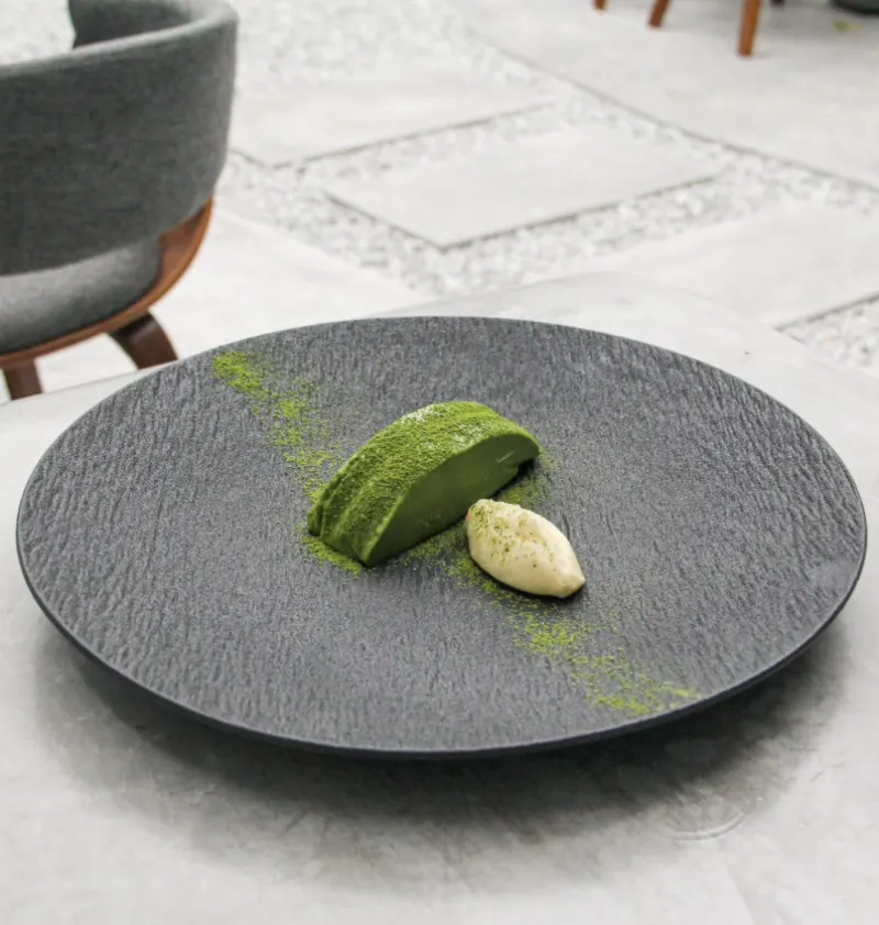 Matcha dessert on a slate plate